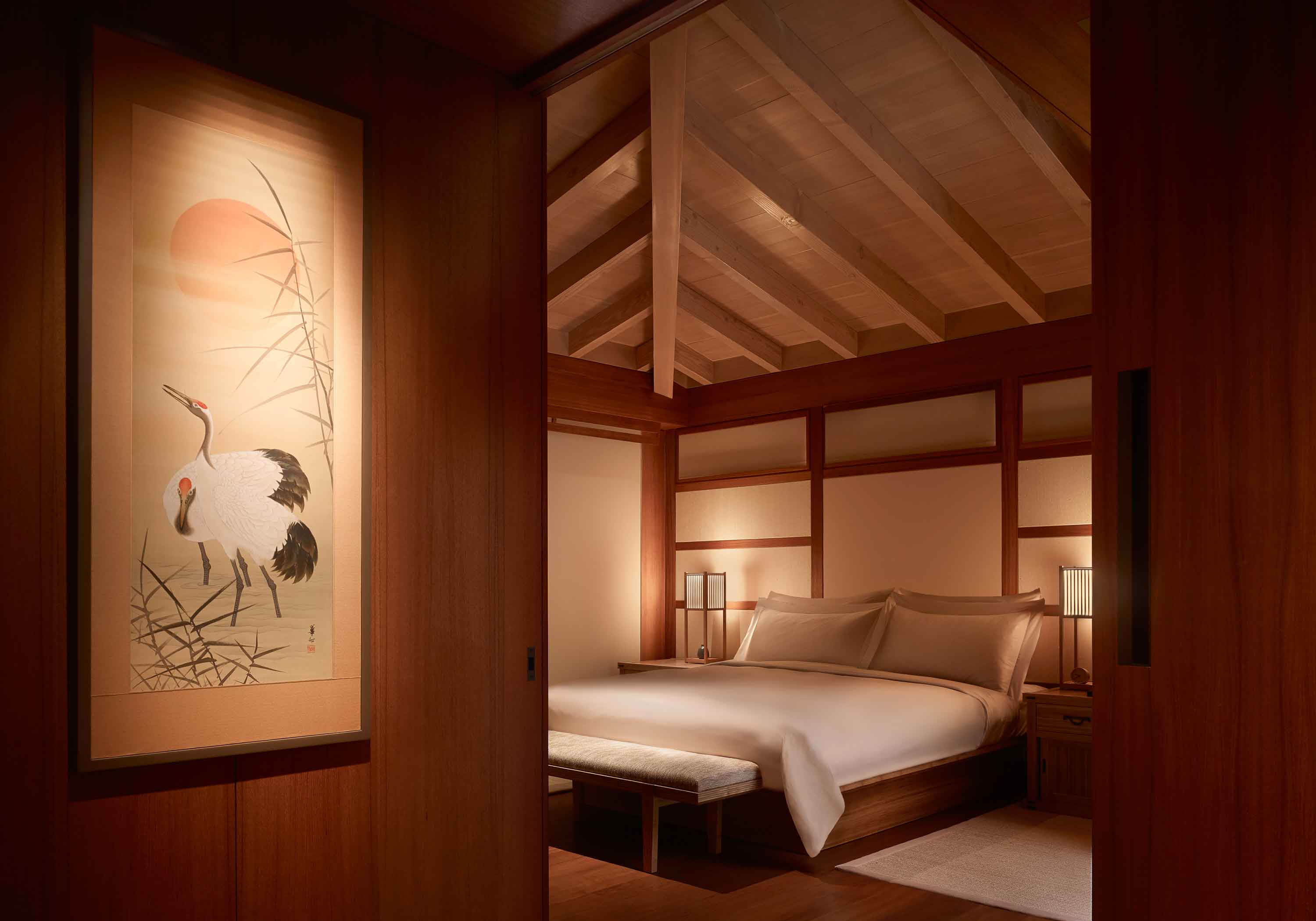 Inside of a bedroom at Nobu Ryokan Malibu with a bed, night stands and high ceilings
